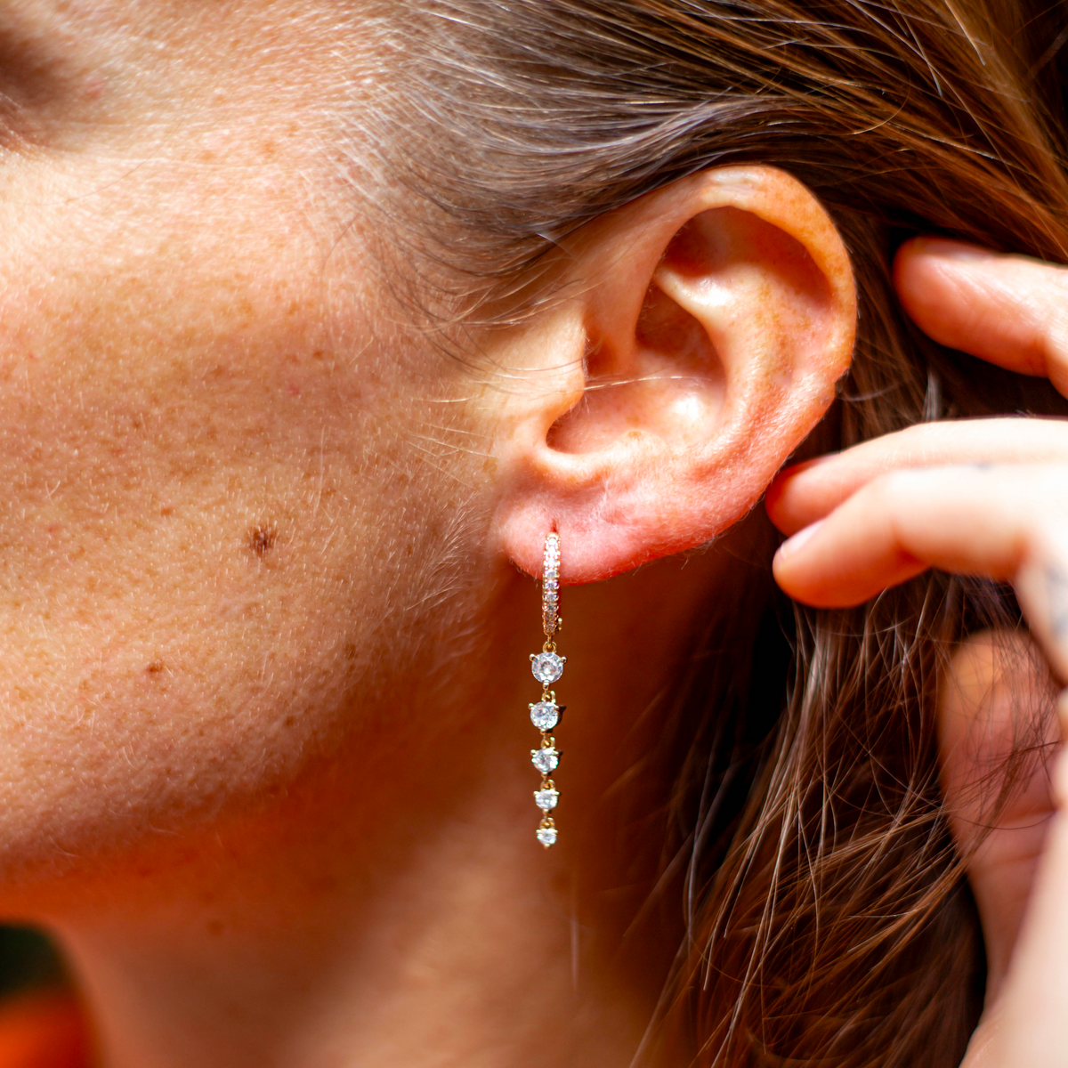 créoles pendantes strass face